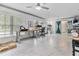Spacious bonus room with white walls, large windows, and white tile floors at 4407 Lake Trudy Dr, St Cloud, FL 34769