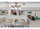 View of the dining room with wood table and kitchen in the background at 4407 Lake Trudy Dr, St Cloud, FL 34769