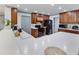 Kitchen with white countertops, black appliances, and ample cabinet space at 4407 Lake Trudy Dr, St Cloud, FL 34769