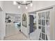 Bright living room area, seamlessly blending living and work areas with modern tile flooring at 4407 Lake Trudy Dr, St Cloud, FL 34769