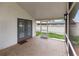 Enclosed porch with tiled flooring and doors to the exterior backyard area at 4407 Lake Trudy Dr, St Cloud, FL 34769