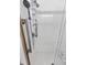 Close-up of a modern shower with accessible grab bars and tile surround at 4407 Lake Trudy Dr, St Cloud, FL 34769