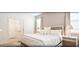Comfortable bedroom featuring a queen-sized bed, neutral decor, and lots of natural light at 4504 Monado Dr, Kissimmee, FL 34746