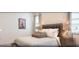 Cozy bedroom with queen bed, neutral decor, and side table lamps at 4504 Monado Dr, Kissimmee, FL 34746