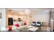 Open-concept living area with dining room and island kitchen featuring modern decor and white tile flooring at 4504 Monado Dr, Kissimmee, FL 34746
