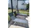Relaxing patio seating with three comfortable lounge chairs at 4504 Monado Dr, Kissimmee, FL 34746
