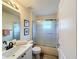 Clean bathroom featuring updated vanity, mirror, and a shower tub combo at 458 Moscato Dr, Davenport, FL 33897