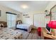 Cheerful bedroom with Mickey Mouse theme, natural light and laminate wood floors at 458 Moscato Dr, Davenport, FL 33897