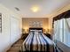Comfortable bedroom with plush carpeting, soft lighting, and modern furnishings at 458 Moscato Dr, Davenport, FL 33897