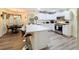 Bright, open kitchen with quartz countertops, stainless steel appliances, and a dining area at 458 Moscato Dr, Davenport, FL 33897