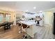 Open-concept kitchen featuring a large island, stainless steel appliances, and white cabinets at 458 Moscato Dr, Davenport, FL 33897