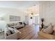 Spacious living room with hardwood floors, vaulted ceiling, and natural light at 458 Moscato Dr, Davenport, FL 33897