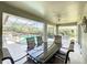 View of the spacious screened patio featuring dining table and chairs overlooking the pool at 458 Moscato Dr, Davenport, FL 33897