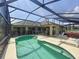 Inviting screened-in pool and patio with safety fence provides a secure outdoor living space at 458 Moscato Dr, Davenport, FL 33897