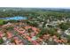 Birds eye view of home with a community pool and mature tree coverage at 5015 Nassau Cir # 4, Orlando, FL 32808