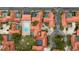 Beautiful aerial view of the community featuring red tile roofs, mature landscaping, and community pool at 5015 Nassau Cir # 4, Orlando, FL 32808