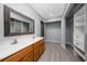 Bright bathroom features double sinks, wood cabinets and a spacious walk-in closet at 5015 Nassau Cir # 4, Orlando, FL 32808