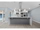 Bright and spacious kitchen featuring a large island, stainless steel appliances, and stylish pendant lights at 5015 Nassau Cir # 4, Orlando, FL 32808