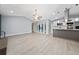 Spacious open floor plan showcasing kitchen with island and access to the outdoor screened patio and pool at 5015 Nassau Cir # 4, Orlando, FL 32808