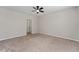 Large, neutral bedroom features a ceiling fan and plush carpet at 5288 Stephs Field St, St Cloud, FL 34771
