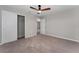 Spacious bedroom with neutral walls, carpet, closet, and a ceiling fan at 5288 Stephs Field St, St Cloud, FL 34771