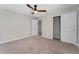 Spacious bedroom featuring a ceiling fan and closet, providing comfort and functionality at 5288 Stephs Field St, St Cloud, FL 34771