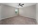 Well-lit bedroom with a large window, neutral walls and carpet at 5288 Stephs Field St, St Cloud, FL 34771