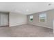 Large bonus room featuring carpeted floors and two windows providing natural light at 5288 Stephs Field St, St Cloud, FL 34771