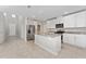 Modern kitchen with stainless steel appliances, granite countertops, island and tile flooring at 5288 Stephs Field St, St Cloud, FL 34771