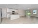 Modern eat-in kitchen with stainless steel appliances, granite countertops, and tile flooring at 5288 Stephs Field St, St Cloud, FL 34771