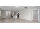 Spacious, open-concept, living room and kitchen combo with tile flooring at 5288 Stephs Field St, St Cloud, FL 34771