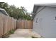 Spacious backyard area with a wooden fence offering privacy and potential at 5810 Paradise Ln, Orlando, FL 32808