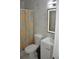 Bathroom featuring a tiled shower with a decorative curtain at 5810 Paradise Ln, Orlando, FL 32808