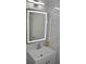 Bathroom featuring a modern lighted mirror and updated vanity at 5810 Paradise Ln, Orlando, FL 32808