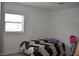 This bedroom features neutral walls and one window for natural light at 5810 Paradise Ln, Orlando, FL 32808