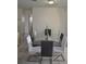 Dining room featuring a glass-top table with seating for six at 5810 Paradise Ln, Orlando, FL 32808