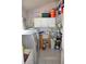 A utility room with modern washing machine, utility sink, and storage cabinets at 5810 Paradise Ln, Orlando, FL 32808
