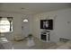 Bright living room featuring a door, large television, tiled floors and comfortable seating at 5810 Paradise Ln, Orlando, FL 32808