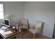 Home office with computer, desk, and two chairs at 5810 Paradise Ln, Orlando, FL 32808