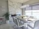 Dining area featuring a marble table, modern chairs, and a decorative fireplace at 585 Lucerne Blvd, Winter Haven, FL 33881