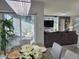 Dining area with marble table and chairs, with a view of the living room and patio at 585 Lucerne Blvd, Winter Haven, FL 33881