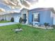 Inviting single-story home featuring beautiful landscaping and a two-car garage at 585 Lucerne Blvd, Winter Haven, FL 33881
