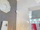 Hallway featuring modern accents and decor with a red door visible in the background at 585 Lucerne Blvd, Winter Haven, FL 33881
