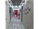 Hallway with marble floors, recessed lighting, and bright red front door at 585 Lucerne Blvd, Winter Haven, FL 33881