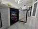Kitchen island including beverage refrigerator with open door at 585 Lucerne Blvd, Winter Haven, FL 33881