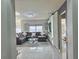 Spacious living room with a large sectional sofa, modern decor, and ample natural light at 585 Lucerne Blvd, Winter Haven, FL 33881
