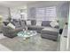 Spacious living room with a large sectional sofa and modern decor and great natural lighting at 585 Lucerne Blvd, Winter Haven, FL 33881
