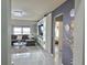 Living Room with marble floors and a view to Primary bedroom at 585 Lucerne Blvd, Winter Haven, FL 33881