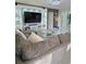 Comfortable living room with large sofa, media center, and decorative lighting at 585 Lucerne Blvd, Winter Haven, FL 33881