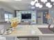 Open concept design, kitchen island extending to living room with large entertainment center at 585 Lucerne Blvd, Winter Haven, FL 33881